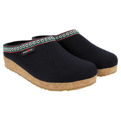 Grizzly GZ - Navy-colored wool felt house slipper, shown from the side, featuring white, green, and red webbing trim around the upper edge.